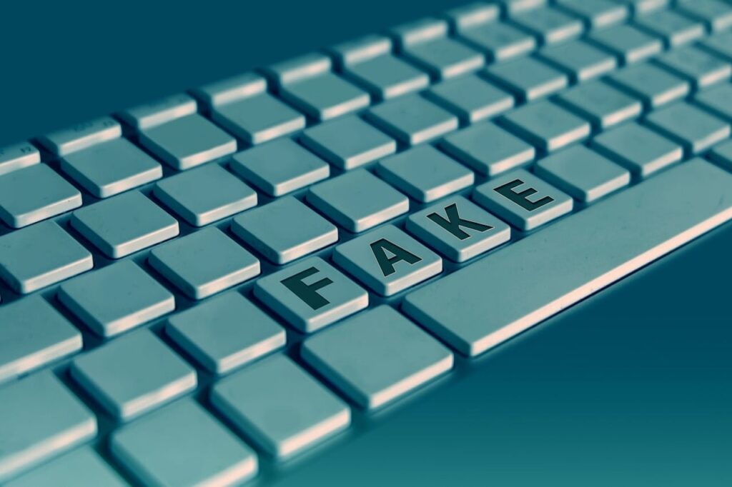 F A K E on keyboard image